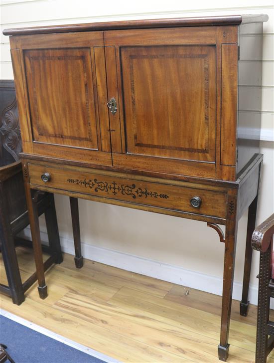 A late Victorian banded and inlaid mahogany cupboard on stand, H.132cm